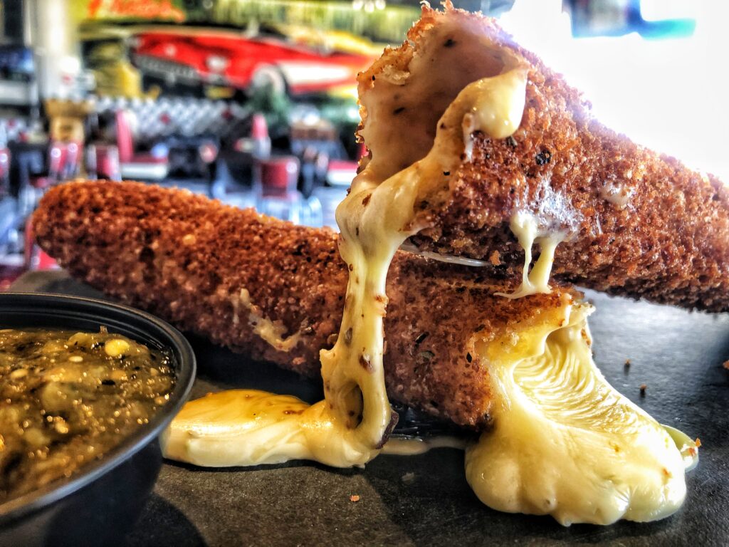 Biggest Taco Mozz Stick in the World - Frato's Schaumburg 1 El Masivo Gringo, Frato’s 13-inch taco mozzarella stick, cut open with a cheese pull and salsa verde