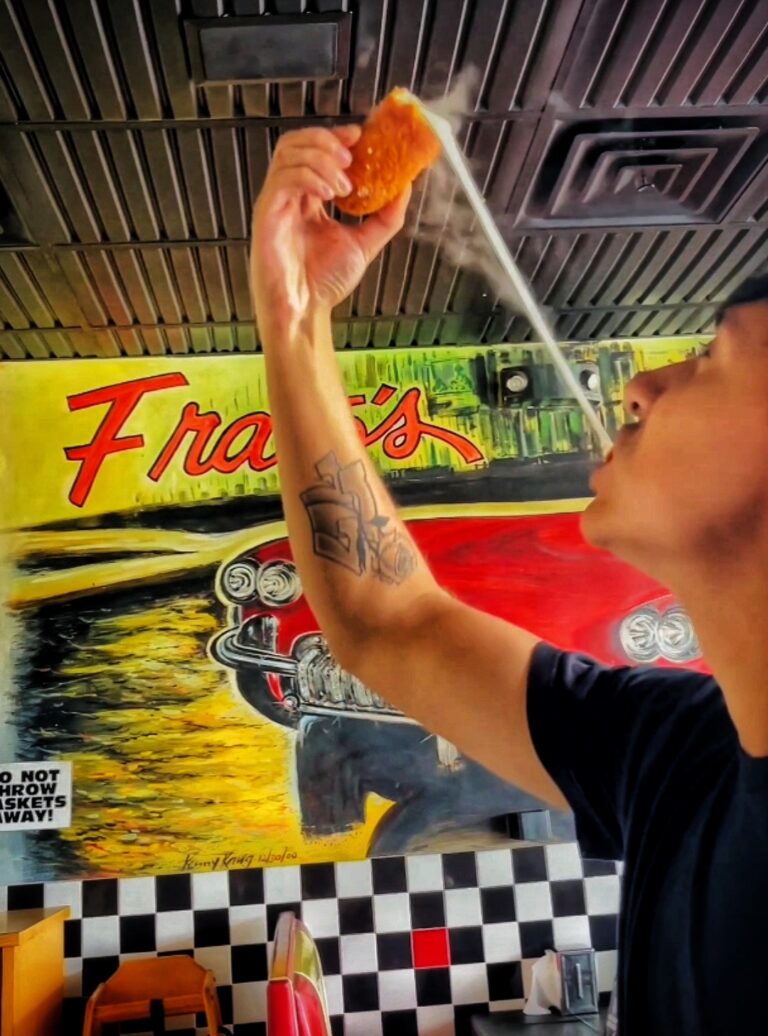 Cheesepull from a huge handmade mozzarella stick at Frato's in Schaumburg