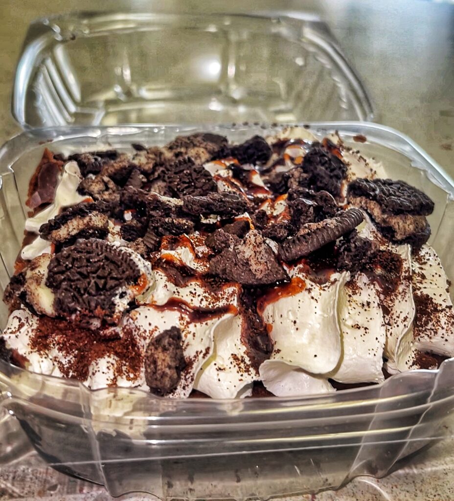 Grandma Frato's Mocha Brownie with espresso, whipped cream, chocolate drizzle and OREO crumble