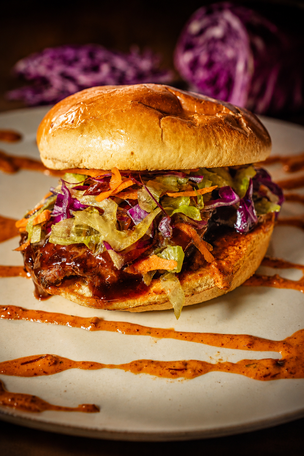 Korean BBQ Burger with two smoked bacon-beef patties, house-made chili garlic sauce, signature Korean BBQ sauce, and fresh Asian slaw on a grilled Turano bun