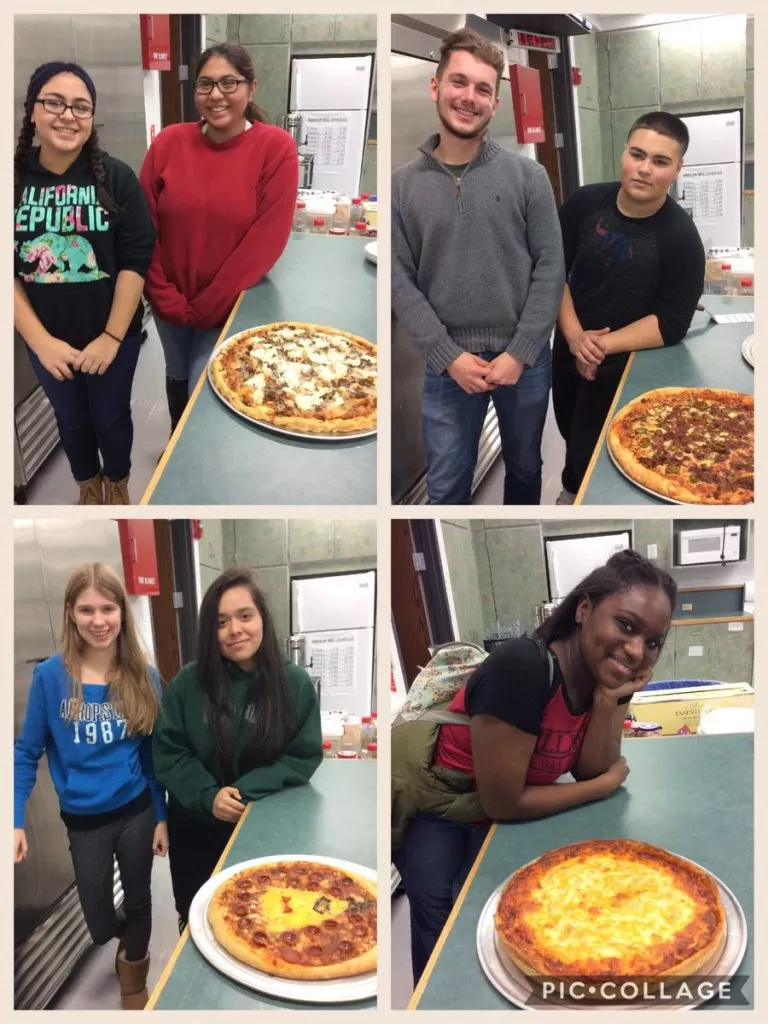 Student pizza competition winners with their pizzas at Frato’s