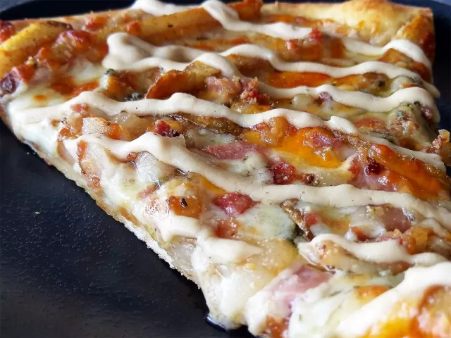 Bacon Poutine Pizza, a past Frato’s specialty pizza in Schaumburg, IL
